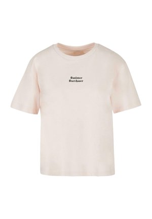 T-shirt in cotone rosa chiaro con maniche corte, scollatura rotonda e testo nero che recita "Sunlover Starchaser" al centro del davanti.
