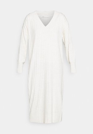 Šviesiai grietinėlės spalvos V formos kaklo, ilgomis rankovėmis, ribotuotas suknelė. Minkšta tekstūra, siaurėjantis apatinis kraštas ir elastingi rankogaliai. Paprasta, tiesi siluetas.