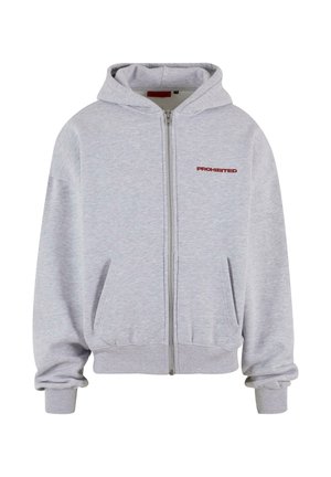 Gray zip-up hoodie made of soft fabric, featuring a front pocket and red "PROHIBITED" text on the left chest area.