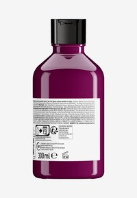 Paarse plastic fles met een zwarte dop, voorzien van een wit etiket met productinformatie en recycling symbolen. Bevat 300 mL.
