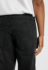 Denim Project Avar lõikega teksad - black washed