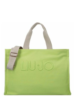 Jasnozielona prostokątna torba typu shopper z beżowymi uchwytami i odpinanym paskiem na ramię, z tłoczonym logo "LIU·JO" na przodzie.