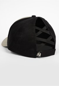 Black baseball cap with an adjustable strap. Features a grey front panel, textured black fabric, and crisscross detailing at the back.