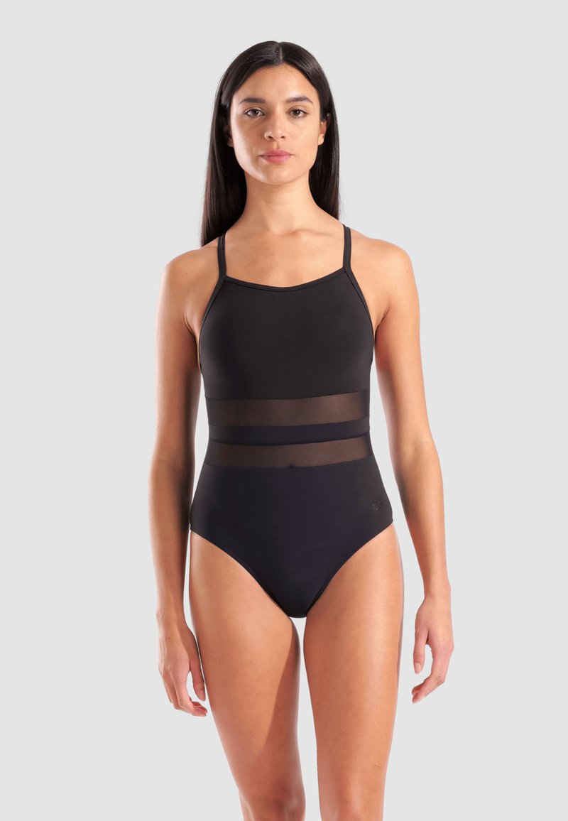 Μαύρο ολόγραμμα μαγιό με διαφανείς επενδύσεις από δίχτυ στη μέση, ρυθμιζόμενες τιράντες και υψηλές ανοίξεις στα πόδια για εφαρμοστή σχεδίαση.