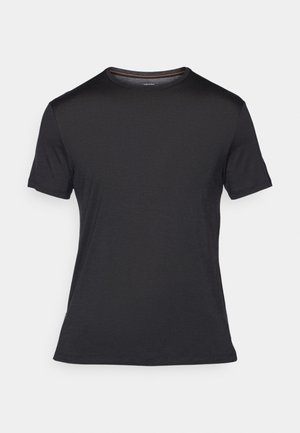 Camiseta negra de manga corta hecha de tela suave, con cuello redondo, ajuste slim y costuras mínimas en el dobladillo y las mangas.