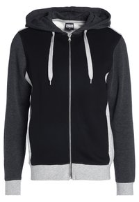 Felpa con zip nera e grigia con cappuccio. Presenta rifiniture grigie, maniche a contrasto e lacci. Realizzata in un tessuto morbido e testurizzato.