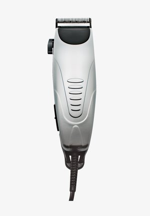 Cortapelos eléctrico con cuerpo plateado, cuchillas negras para recortar, botón de control en el lateral y cable de alimentación negro unido en la parte inferior.