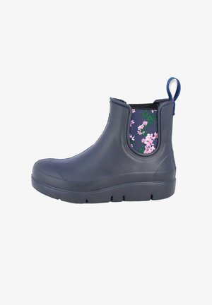 Botte en caoutchouc marine à cheville avec panneau latéral en tissu fleuri, tirette, bout arrondi et semelle texturée pour une meilleure adhérence. Imperméable et conçue pour le confort.