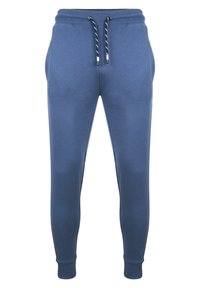 Tmavě modré tepláky z měkké látky, s elastickým pasem se stahovacími šňůrkami, bočními kapsami a elastickými manžetami.