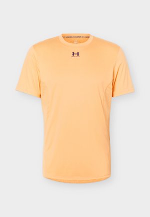 Men's short-sleeve peach Under Armour athletic t-shirt with crew neck and brand logo centered below collar.