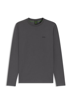 Hosszú ujjú, szürke póló puha anyagból, kerek nyakkivágással és egy kis fekete logóval a mellrészen. Egyszerű, klasszikus kialakítás.