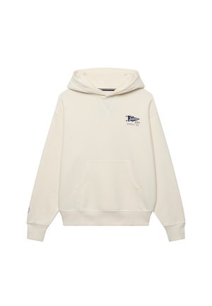 Flødefarvet pullover hoodie med front kængurulomme og lille navyblåt "Super Dry Supply Co." logo på øverste venstre bryst.