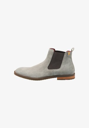 Bottines en daim gris avec des panneaux latéraux en élasthanne noir et un talon en bois marron. Dotées d'une languette à l'arrière avec un accent de couleur.