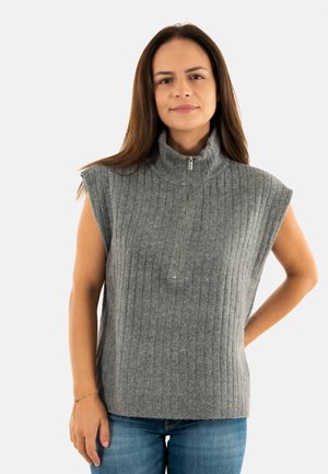 Haut sans manches gris à col roulé en tissu côtelé, avec une fermeture éclair mi-zippée et une coupe décontractée.