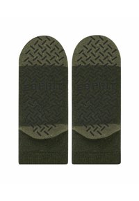 Grüne Socken mit einem strukturierten Griffmuster an der Sohle, das einen glatten oberen Bereich und ein Logo-Detail in der Mitte aufweist.