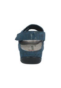 Blue suede sandal with adjustable strap, textured upper, cushioned footbed, and black rubber sole; rear view showcasing strap detail.