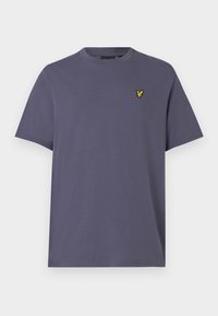 Μωβ βαμβακερό t-shirt με στρογγυλή λαιμόκοψη και κοντά μανίκια, με ένα μικρό κίτρινο λογότυπο πουλιάς στο αριστερό στήθος. Απλός σχεδιασμός.