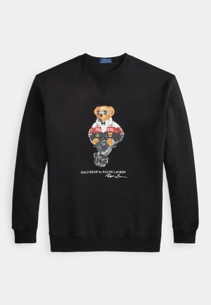 Sweat-shirt noir à manches longues avec un graphique d'un ours portant des lunettes de soleil et une veste, étiqueté "Polo Bear by Ralph Lauren" en dessous.