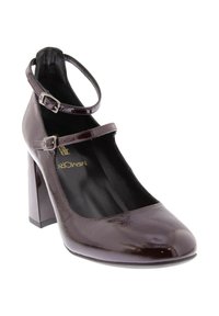 Shoe con tacco alto glossy di un viola scuro, con punta tonda, cinturino alla caviglia e tacco a blocco. Texture liscia e dettagli di design minimi.