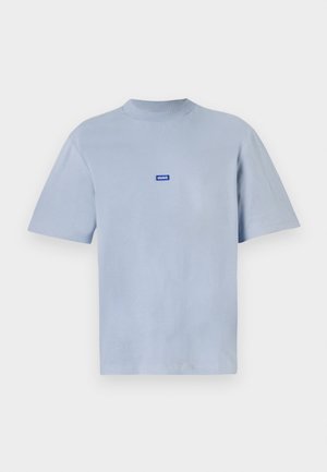 Light blue cotton t-shirt with a round neckline, short sleeves, and a small blue and white logo patch on the chest.