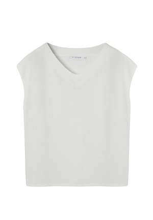 Chaleco de punto blanco sin mangas con cuello en V y bordes acanalados, talla pequeña, exhibido sobre un fondo blanco.