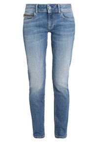 Jeans ajustados de denim azul claro, con un acabado desgastado, cinco bolsillos y un bolsillo con cremallera en el muslo izquierdo.