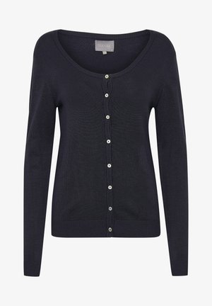 Temno moder cardigan iz mehkega pletenega materiala, z ovratnikom v obliki kroga, dolgimi rokavi in vrstico okroglih gumbov spredaj.
