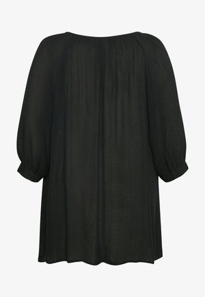 Zwarte, lichte blouse met een losse pasvorm, ronde halslijn en lange, iets gepofte mouwen. Voorzien van knoopmanchetten en een zachte textuur.