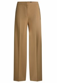 Tan wide-leg trousers with a flat front, dual zippered pockets, and smooth fabric texture. Features clean lines and a tailored silhouette.