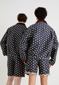 Sister Jane BUCK FLOWER JACKET UNISEX - Denim jacket - navy