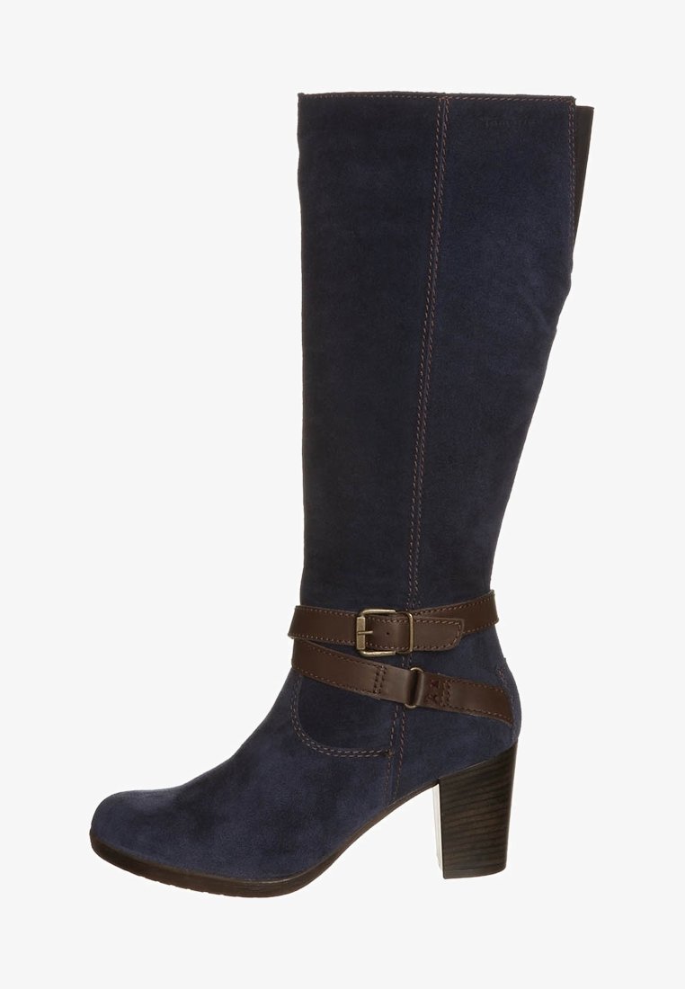 Knee-high navy blue suede boot with a brown leather strap and buckle accent. Features a square toe and a chunky heel for added stability.