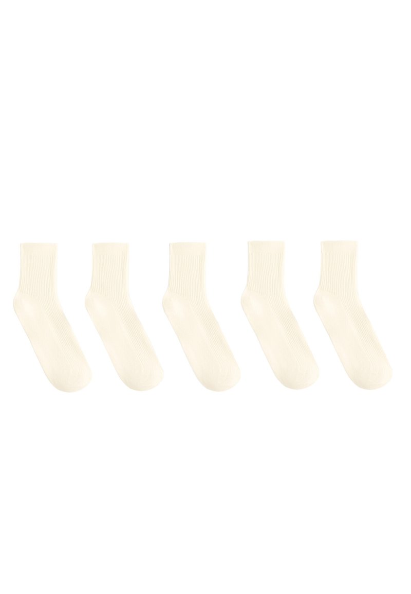 Cotton crew socks in off-white. Ribbed texture at the top, smooth body, and rounded toe. Set of five pairs.