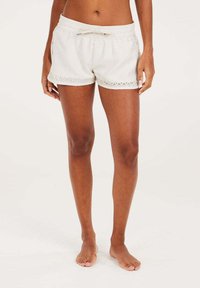 Pantaloni shorts beige chiaro con vita elastica e lacci regolabili. Presentano un bordo in pizzo all'orlo e tasche laterali, realizzati in tessuto morbido.