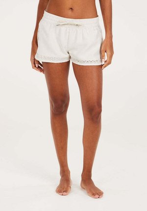 Lichtbeige shorts met een elastische tailleband en een verstelbare strik. Voorzien van kanten rand aan de zoom en zijzakken, gemaakt van een zachte stof.