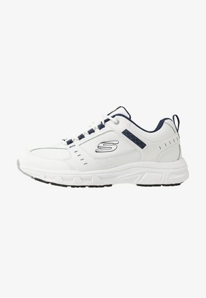 White athletic sneakers with navy accents, featuring a textured upper, lace closure, padded collar, and a durable rubber outsole.