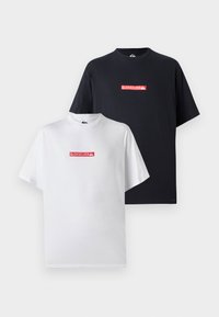 Two T-shirts, one white and one black, both featuring a red Quiksilver logo on the front, in a relaxed fit with short sleeves.