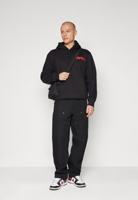 Carhartt WIP DOUBLE KNEE PANT - Broek - black rigid