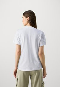 Calvin Klein MULTI LOGO REGULAR T-SHIRT - Tricou basic - bright white