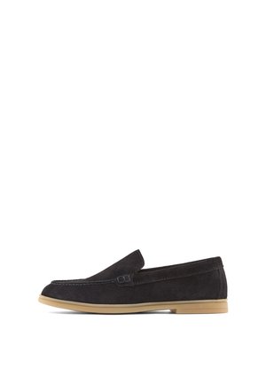Black suede slip-on loafer with beige rubber sole, low heel, and minimal stitching detail along the edges, shown in side profile.