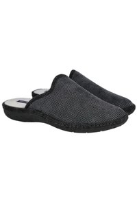 Zapatillas negras de tipo slip-on con un upper de tela texturizada, ribete negro en contraste y una plantilla acolchada. Cuenta con una suela externa de goma flexible.