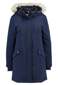Navy blue parka with faux fur trim on the hood, zip closure, two front pockets, ribbed cuffs, and vertical seams.