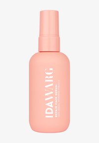 Rosa plastflaska med IDAWARG Repair Hair Serum, utrustad med spraymunstycke och vit text som beskriver dess 100 % veganska och återställande formula.