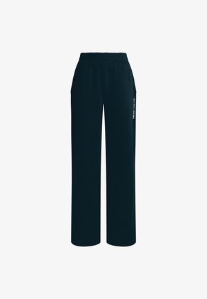 Schwarze, lockere Sweatpants mit elastischem Bund, Seitentaschen und dem in Weiß auf dem linken Bein aufgedruckten "RED BULL RACING"-Logo.