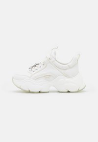 White chunky sneakers with leather and mesh materials, featuring a thick sole, rounded toe, and decorative laces. Lightly textured accents.