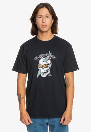 Black cotton t-shirt featuring a graphic of a skull with sunglasses and surfboards. The design includes white and colorful accents.