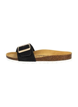 Sandale à glissière en suede noir avec une boucle en argent, semelle en liège et semelle en caoutchouc blanc, présentant un design plat et une finition texturée.