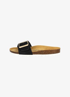 Sandale à glissière en suede noir avec une boucle en argent, semelle en liège et semelle en caoutchouc blanc, présentant un design plat et une finition texturée.