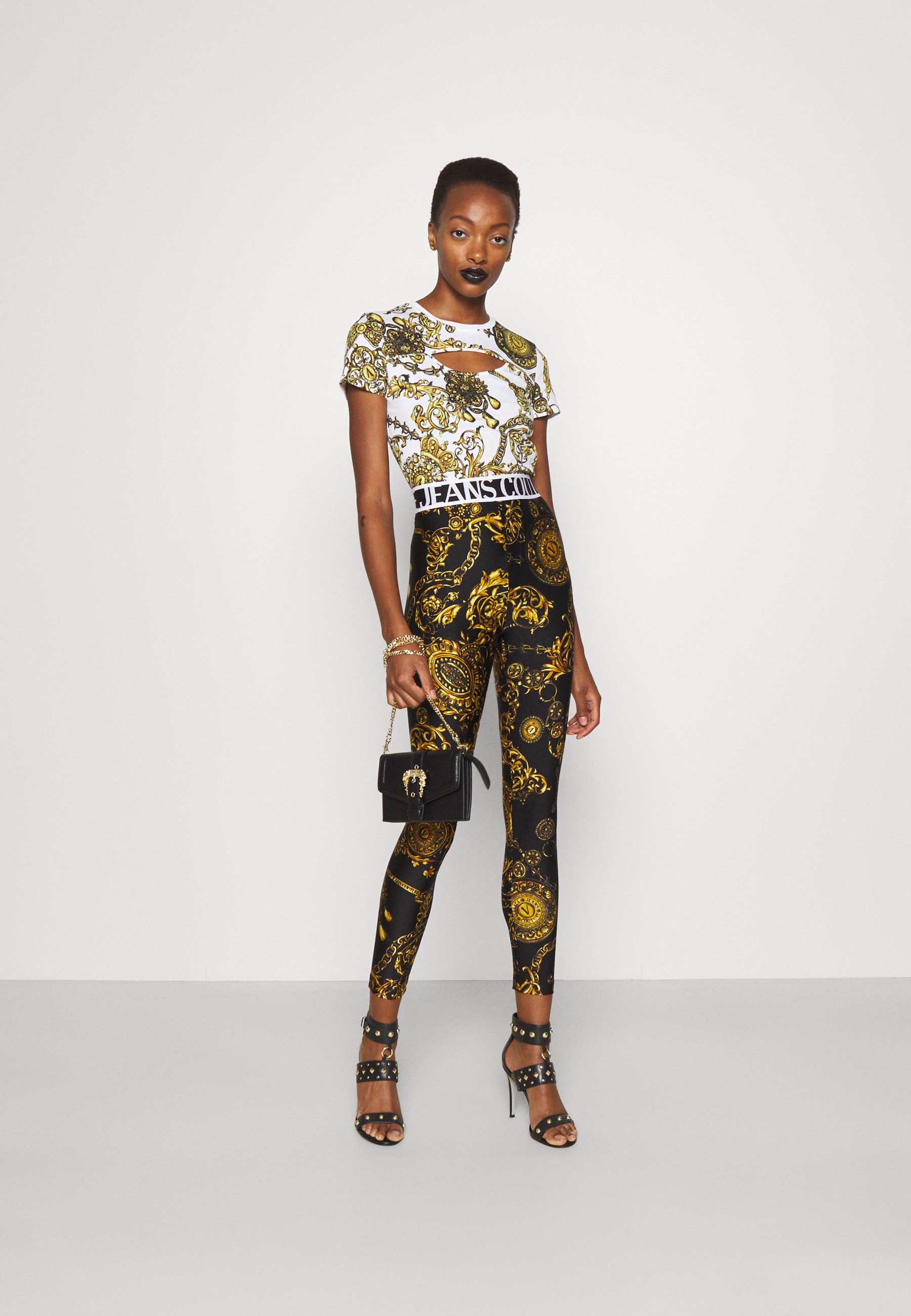 Versace Jeans Couture PANTS - Leggings - Trousers - black/gold/black -  Zalando.co.uk