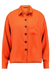 Orange button-up skjorte lavet af glat stof, med en brystlomme og sorte knapper, i en afslappet pasform med lange ærmer.