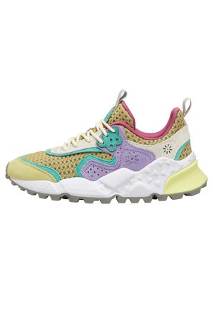 Colorful sneaker featuring a breathable mesh upper in yellow, green, purple, and pink, with a textured white sole and patterned accents.